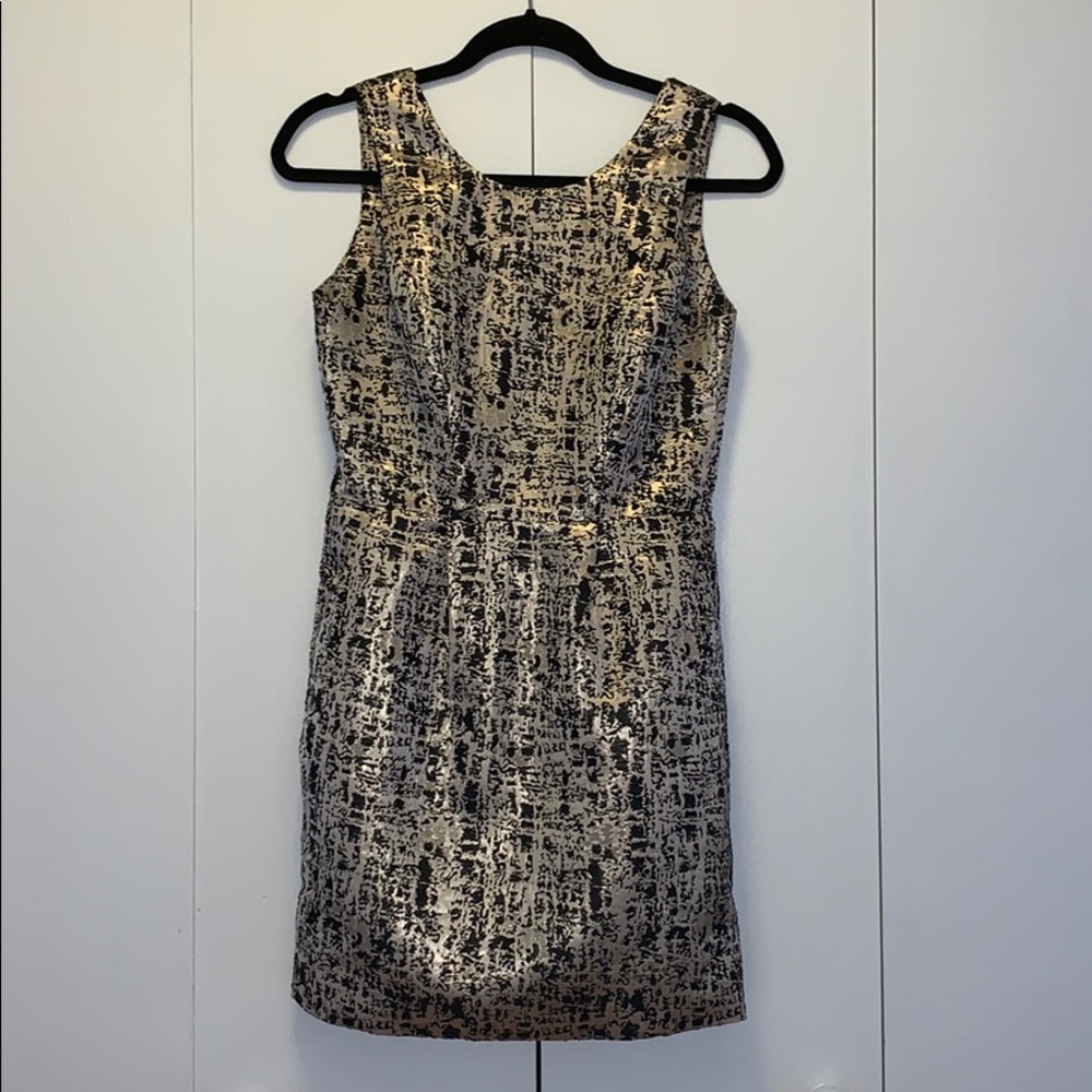 Black and gold cocktail dress.
